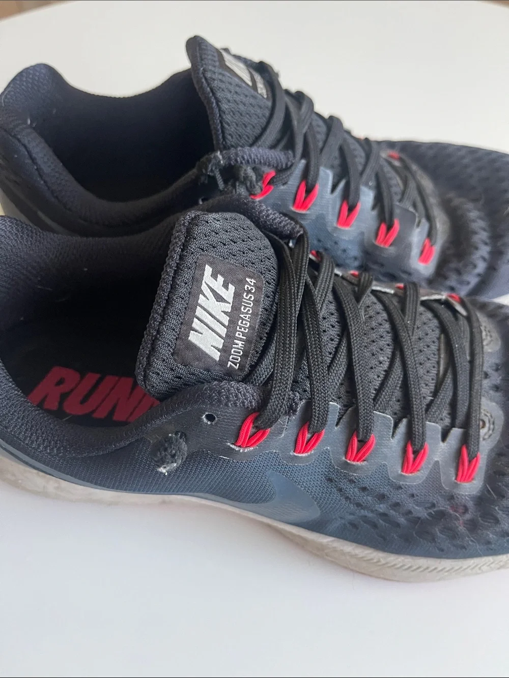 Nike Men’s Black Running Shoes with Pink-Red Accents